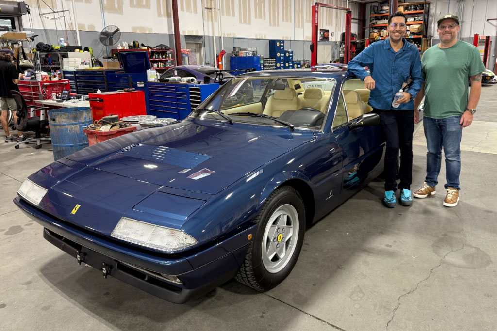 blue 1987 ferrari 412 in the automotive international garage